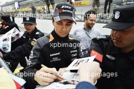 Sergio Perez (MEX) Sahara Force India F1 signs autographs for the fans. 09.04.2015. Formula 1 World Championship, Rd 3, Chinese Grand Prix, Shanghai, China, Preparation Day.