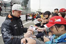 Nico Hulkenberg (GER) Sahara Force India F1 signs autographs for the fans. 09.04.2015. Formula 1 World Championship, Rd 3, Chinese Grand Prix, Shanghai, China, Preparation Day.