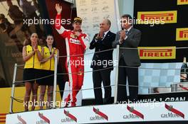 Sebastian Vettel (GER) Ferrari celebrates his third position on the podium. 10.05.2015. Formula 1 World Championship, Rd 5, Spanish Grand Prix, Barcelona, Spain, Race Day.