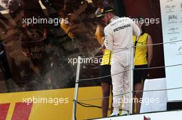 Lewis Hamilton (GBR) Mercedes AMG F1 celebrates his second position with the champagne on the podium. 10.05.2015. Formula 1 World Championship, Rd 5, Spanish Grand Prix, Barcelona, Spain, Race Day.
