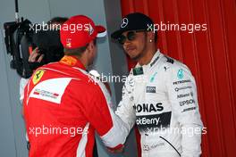 (L to R): Sebastian Vettel (GER) Ferrari celebrates with Lewis Hamilton (GBR) Mercedes AMG F1 in qualifying parc ferme. 09.05.2015. Formula 1 World Championship, Rd 5, Spanish Grand Prix, Barcelona, Spain, Qualifying Day.