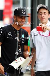 Lewis Hamilton (GBR) Mercedes AMG F1 with a fan. 03.07.2015. Formula 1 World Championship, Rd 9, British Grand Prix, Silverstone, England, Practice Day.