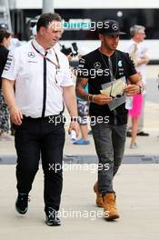 Lewis Hamilton (GBR) Mercedes AMG F1 with Ron Meadows (GBR) Mercedes GP Team Manager. 03.07.2015. Formula 1 World Championship, Rd 9, British Grand Prix, Silverstone, England, Practice Day.