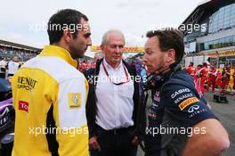 (L to R): Cyril Abiteboul (FRA) Renault Sport F1 Managing Director with Dr Helmut Marko (AUT) Red Bull Motorsport Consultant and Christian Horner (GBR) Red Bull Racing Team Principal on the grid. 05.07.2015. Formula 1 World Championship, Rd 9, British Grand Prix, Silverstone, England, Race Day.