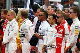 Lewis Hamilton (GBR) Mercedes AMG F1 as the grid observes the national anthem. 05.07.2015. Formula 1 World Championship, Rd 9, British Grand Prix, Silverstone, England, Race Day.