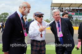 (L to R): HRH Prince Michael of Kent (GBR) with Jackie Stewart (GBR) and Michael Fallon MP (GBR) Defence Secretary  on the grid. 05.07.2015. Formula 1 World Championship, Rd 9, British Grand Prix, Silverstone, England, Race Day.