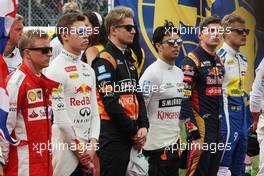 Nico Hulkenberg (GER) Sahara Force India F1 and Sergio Perez (MEX) Sahara Force India F1 as the grid observes the national anthem. 05.07.2015. Formula 1 World Championship, Rd 9, British Grand Prix, Silverstone, England, Race Day.