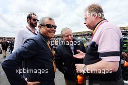 (L to R): Sir Martin Sorrell (GBR) WPP CEO with Jean Todt (FRA) FIA President and Andy Palmer (GBR) Aston Martin CEO on the grid. 05.07.2015. Formula 1 World Championship, Rd 9, British Grand Prix, Silverstone, England, Race Day.