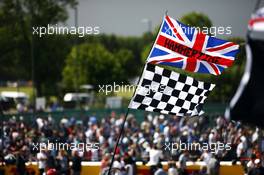 Fans invade the circuit at the podium. 05.07.2015. Formula 1 World Championship, Rd 9, British Grand Prix, Silverstone, England, Race Day.