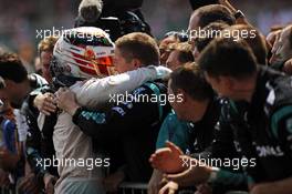 race winner Lewis Hamilton (GBR) Mercedes AMG F1 celebrates with the team in parc ferme. 05.07.2015. Formula 1 World Championship, Rd 9, British Grand Prix, Silverstone, England, Race Day.