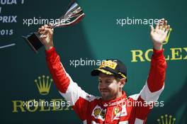 Sebastian Vettel (GER) Ferrari celebrates his third position on the podium. 05.07.2015. Formula 1 World Championship, Rd 9, British Grand Prix, Silverstone, England, Race Day.