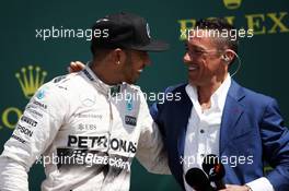 The podium (L to R): Race winner Lewis Hamilton (GBR) Mercedes AMG F1 with Frank Dernie (GBR). 05.07.2015. Formula 1 World Championship, Rd 9, British Grand Prix, Silverstone, England, Race Day.