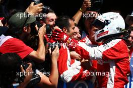 Sebastian Vettel (GER) Ferrari celebrates his third position with the team in parc ferme. 05.07.2015. Formula 1 World Championship, Rd 9, British Grand Prix, Silverstone, England, Race Day.