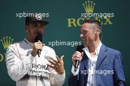 The podium (L to R): Race winner Lewis Hamilton (GBR) Mercedes AMG F1 with Frank Dernie (GBR). 05.07.2015. Formula 1 World Championship, Rd 9, British Grand Prix, Silverstone, England, Race Day.
