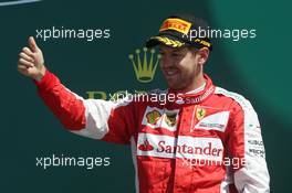Sebastian Vettel (GER) Ferrari celebrates his third position on the podium. 05.07.2015. Formula 1 World Championship, Rd 9, British Grand Prix, Silverstone, England, Race Day.
