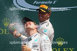 Race winner Lewis Hamilton (GBR) Mercedes AMG F1 celebrates on the podium with team mate Nico Rosberg (GER) Mercedes AMG F1. 05.07.2015. Formula 1 World Championship, Rd 9, British Grand Prix, Silverstone, England, Race Day.
