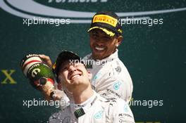 Race winner Lewis Hamilton (GBR) Mercedes AMG F1 celebrates on the podium with team mate Nico Rosberg (GER) Mercedes AMG F1. 05.07.2015. Formula 1 World Championship, Rd 9, British Grand Prix, Silverstone, England, Race Day.