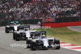 Felipe Massa (BRA) Williams FW37 leads team mate Valtteri Bottas (FIN) Williams FW37 and Lewis Hamilton (GBR) Mercedes AMG F1 W06. 05.07.2015. Formula 1 World Championship, Rd 9, British Grand Prix, Silverstone, England, Race Day.