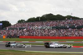 Valtteri Bottas (FIN) Williams FW37 leads Nico Rosberg (GER) Mercedes AMG F1 W06. 05.07.2015. Formula 1 World Championship, Rd 9, British Grand Prix, Silverstone, England, Race Day.