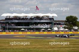 Felipe Massa (BRA) Williams FW37 leads Valtteri Bottas (FIN) Williams FW37 and Lewis Hamilton (GBR) Mercedes AMG F1 W06. 05.07.2015. Formula 1 World Championship, Rd 9, British Grand Prix, Silverstone, England, Race Day.