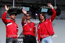 (L to R): Will Stevens (GBR) Manor Marussia F1 Team with Roberto Merhi (ESP) Manor Marussia F1 Team and Graeme Lowdon (GBR) Manor Marussia F1 Team Chief Executive Officer at the post race concert. 05.07.2015. Formula 1 World Championship, Rd 9, British Grand Prix, Silverstone, England, Race Day.