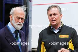 (L to R): HRH Prince Michael of Kent (GBR) with Mario Isola (ITA) Pirelli Racing Manager. 05.07.2015. Formula 1 World Championship, Rd 9, British Grand Prix, Silverstone, England, Race Day.