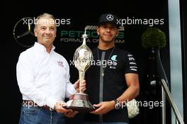 Lewis Hamilton (GBR) Mercedes AMG F1 receives the Hawthorn Memorial Trophy from Rob Jones (GBR) Motor Sports Association (MSA) Chief Executive. 02.07.2015. Formula 1 World Championship, Rd 9, British Grand Prix, Silverstone, England, Preparation Day.