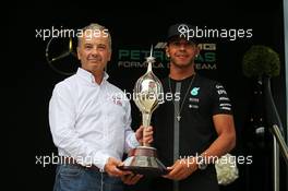 Lewis Hamilton (GBR) Mercedes AMG F1 receives the Hawthorn Memorial Trophy from Rob Jones (GBR) Motor Sports Association (MSA) Chief Executive. 02.07.2015. Formula 1 World Championship, Rd 9, British Grand Prix, Silverstone, England, Preparation Day.