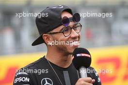 Lewis Hamilton (GBR) Mercedes AMG F1 - new sunglasses. 02.07.2015. Formula 1 World Championship, Rd 9, British Grand Prix, Silverstone, England, Preparation Day.