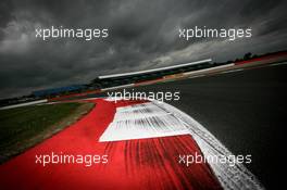 The circuit with dark clouds looming over it. 02.07.2015. Formula 1 World Championship, Rd 9, British Grand Prix, Silverstone, England, Preparation Day.