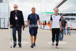 (L to R): Didier Coton (BEL) Driver Manager with Antti Vierula (FIN) Personal Trainer and Kevin Magnussen (DEN) McLaren Test and Reserve Driver. 02.07.2015. Formula 1 World Championship, Rd 9, British Grand Prix, Silverstone, England, Preparation Day.