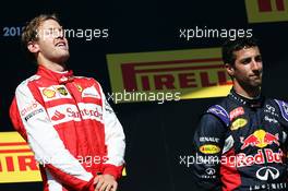 Race winner Sebastian Vettel (GER) Ferrari celebrates on the podium with Daniel Ricciardo (AUS) Red Bull Racing. 26.07.2015. Formula 1 World Championship, Rd 10, Hungarian Grand Prix, Budapest, Hungary, Race Day.