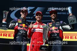 1st place Sebastian Vettel (GER) Ferrari, 2nd place Daniil Kvyat (RUS) Red Bull Racing RB11, and 3rd place Daniel Ricciardo (AUS) Red Bull Racing. 26.07.2015. Formula 1 World Championship, Rd 10, Hungarian Grand Prix, Budapest, Hungary, Race Day.
