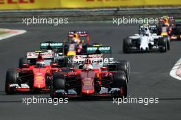 Sebastian Vettel (GER) Ferrari SF15-T leads behind the FIA Safety Car. 26.07.2015. Formula 1 World Championship, Rd 10, Hungarian Grand Prix, Budapest, Hungary, Race Day.