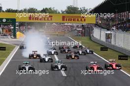 (L to R): Nico Rosberg (GER) Mercedes AMG F1 W06; Lewis Hamilton (GBR) Mercedes AMG F1 W06; Sebastian Vettel (GER) Ferrari SF15-T; and Kimi Raikkonen (FIN) Ferrari SF15-T at the start of the race. 26.07.2015. Formula 1 World Championship, Rd 10, Hungarian Grand Prix, Budapest, Hungary, Race Day.