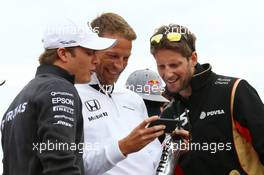 (L to R): Nico Rosberg (GER) Mercedes AMG F1 with Jenson Button (GBR) McLaren and Romain Grosjean (FRA) Lotus F1 Team on the drivers parade. 26.07.2015. Formula 1 World Championship, Rd 10, Hungarian Grand Prix, Budapest, Hungary, Race Day.