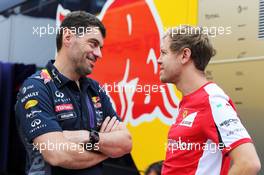 (L to R): Guillaume Rocquelin (ITA) Red Bull Racing Head of Race Engineering with Sebastian Vettel (GER) Ferrari. 26.07.2015. Formula 1 World Championship, Rd 10, Hungarian Grand Prix, Budapest, Hungary, Race Day.