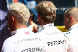 (L to R): Lewis Hamilton (GBR) Mercedes AMG F1 and Nico Rosberg (GER) Mercedes AMG F1 as the grid observes the national anthem. 06.09.2015. Formula 1 World Championship, Rd 12, Italian Grand Prix, Monza, Italy, Race Day.