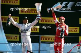 (L to R): Race winner Lewis Hamilton (GBR) Mercedes AMG F1 celebrates with second placed Sebastian Vettel (GER) Ferrari on the podium. 06.09.2015. Formula 1 World Championship, Rd 12, Italian Grand Prix, Monza, Italy, Race Day.