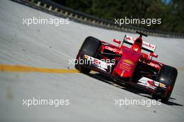 The Ferrari SF15-T on the Monza banking at a Shell photoshoot. 05.09.2015. Formula 1 World Championship, Rd 12, Italian Grand Prix, Monza, Italy, Qualifying Day.