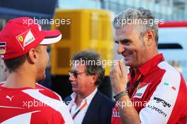 (L to R): Sebastian Vettel (GER) Ferrari with Maurizio Arrivabene (ITA) Ferrari Team Principal. 05.09.2015. Formula 1 World Championship, Rd 12, Italian Grand Prix, Monza, Italy, Qualifying Day.
