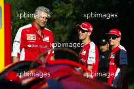 (L to R): Maurizio Arrivabene (ITA) Ferrari Team Principal; Sebastian Vettel (GER) Ferrari and team mate Kimi Raikkonen (FIN) Ferrari on the Monza banking at a Shell photoshoot. 05.09.2015. Formula 1 World Championship, Rd 12, Italian Grand Prix, Monza, Italy, Qualifying Day.