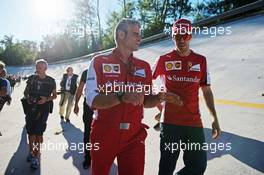 (L to R): Maurizio Arrivabene (ITA) Ferrari Team Principal and Sebastian Vettel (GER) Ferrari on the Monza banking at a Shell photoshoot. 05.09.2015. Formula 1 World Championship, Rd 12, Italian Grand Prix, Monza, Italy, Qualifying Day.