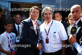 (L to R): Matteo Renzi (ITA) Italian Prime Minister with Pasquale Lattuneddu (ITA) of the FOM. 06.09.2015. Formula 1 World Championship, Rd 12, Italian Grand Prix, Monza, Italy, Race Day.