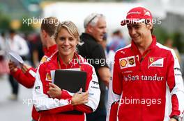 Esteban Gutierrez (MEX) Ferrari Test and Reserve Driver with Britta Roeske (AUT) Ferrari Press Officer. 25.09.2015. Formula 1 World Championship, Rd 14, Japanese Grand Prix, Suzuka, Japan, Practice Day.
