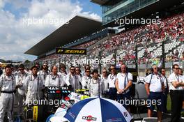 The crew of Valtteri Bottas (FIN) Williams FW37 as the grid observes the national anthem. 27.09.2015. Formula 1 World Championship, Rd 14, Japanese Grand Prix, Suzuka, Japan, Race Day.