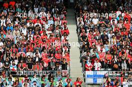 Fans in the grandstand. 27.09.2015. Formula 1 World Championship, Rd 14, Japanese Grand Prix, Suzuka, Japan, Race Day.