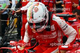 Sebastian Vettel (GER) Ferrari SF15-T on the grid. 27.09.2015. Formula 1 World Championship, Rd 14, Japanese Grand Prix, Suzuka, Japan, Race Day.