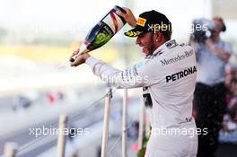 Race winner Lewis Hamilton (GBR) Mercedes AMG F1 celebrates with the champagne on the podium. 27.09.2015. Formula 1 World Championship, Rd 14, Japanese Grand Prix, Suzuka, Japan, Race Day.