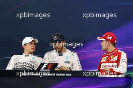 The post race FIA Press Conference (L to R): Nico Rosberg (GER) Mercedes AMG F1, second; Lewis Hamilton (GBR) Mercedes AMG F1, race winner; Sebastian Vettel (GER) Ferrari, third. 27.09.2015. Formula 1 World Championship, Rd 14, Japanese Grand Prix, Suzuka, Japan, Race Day.